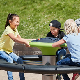 Children spinning on the Orbit roundabout 